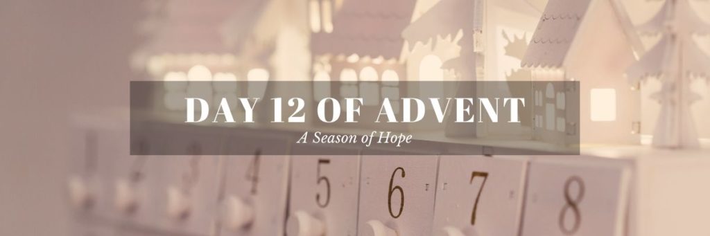 All white advent calendar and Ventura Christmas town made of paper