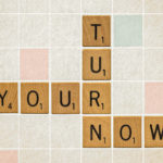 scrabble pieces spelling out the sermon series your turn now