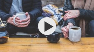 couple drinking coffee listening to church